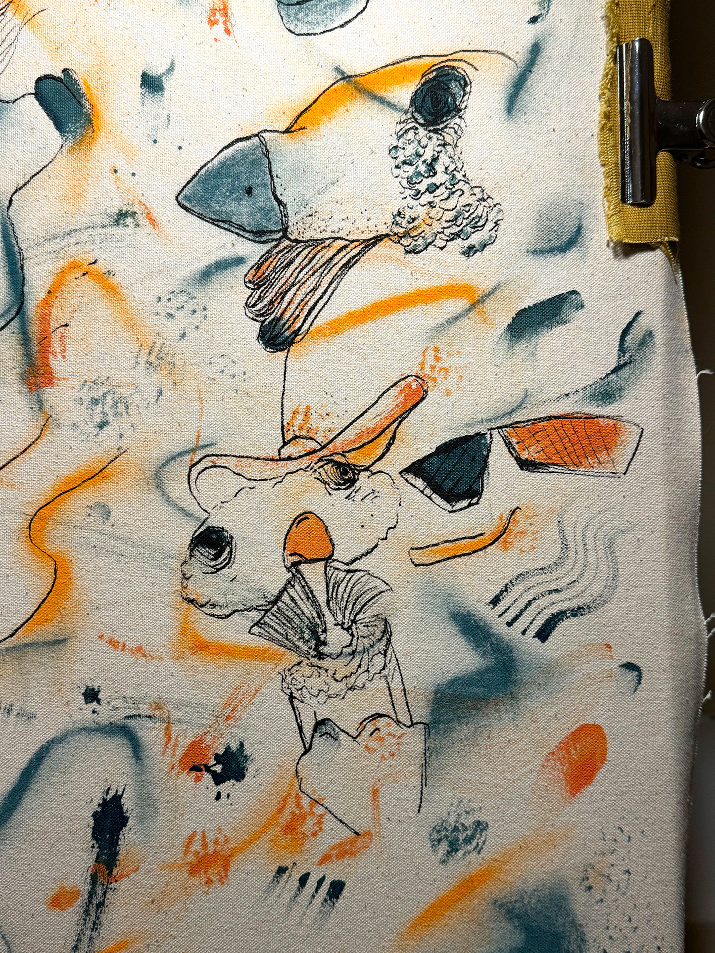 Abstract expressionism artwork on raw cotton canvas. Colours are orange tones, dark and light blue/teal brush strokes. Organic patterns and faces expressing different emotions. Made by Studio Thicia Luiza