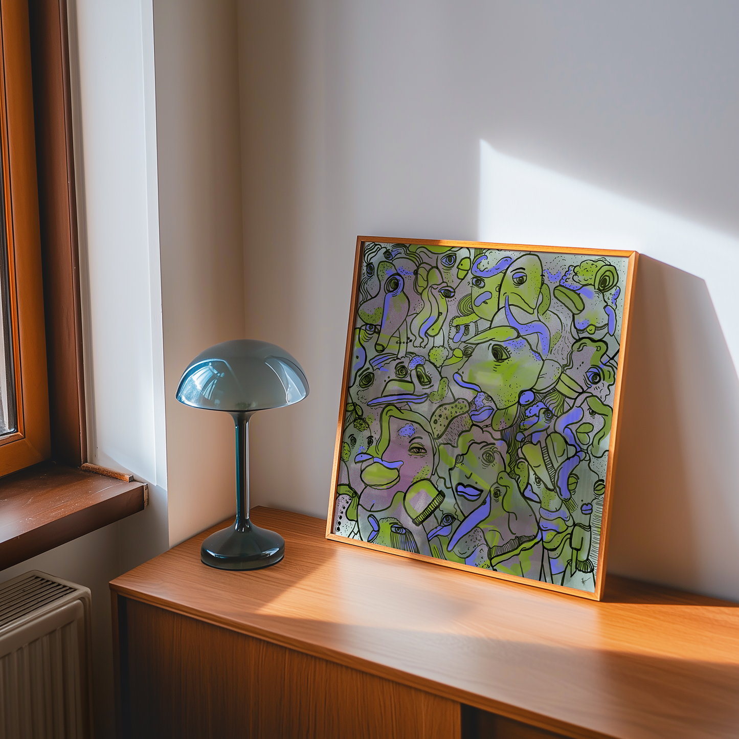 Abstract digital art print with vibrant purple and green, organic patterns and faces expressing different emotions in a timber frame  in a 60s mid century interior design space. Made by Studio Thicia Luiza