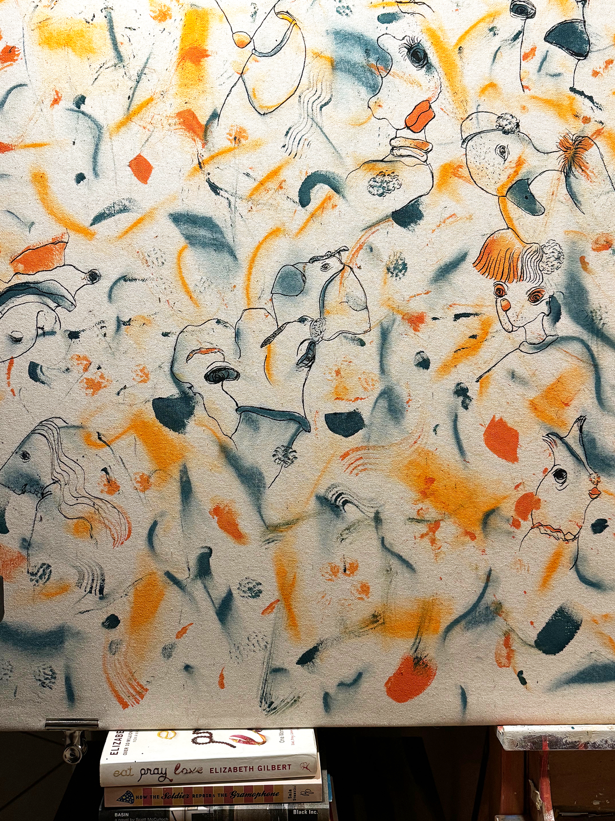 Abstract expressionism artwork on raw cotton canvas. Colours are orange tones, dark and light blue/teal brush strokes. Organic patterns and faces expressing different emotions. Details. Made by Studio Thicia Luiza