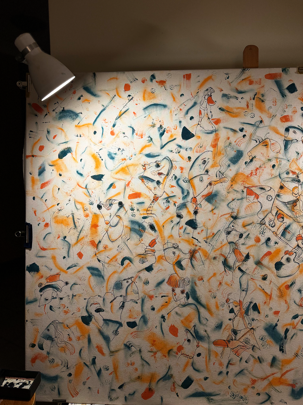 Abstract expressionism artwork on raw cotton canvas. Colours are orange tones, dark and light blue/teal brush strokes. Organic patterns and faces expressing different emotions. Unfinished artwork. Made by Studio Thicia Luiza