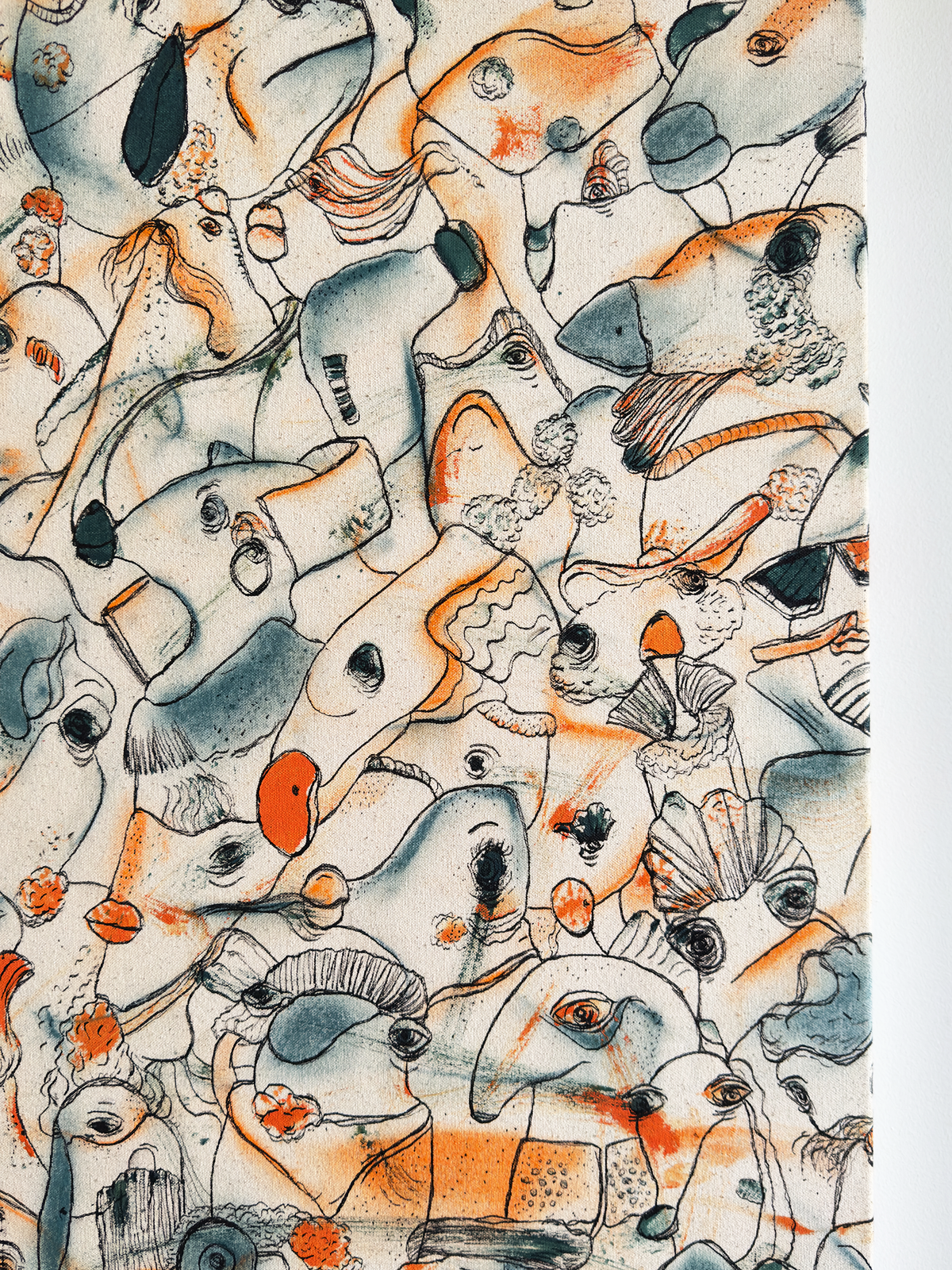 Abstract expressionism artwork on raw cotton canvas. Colours are orange tones, dark and light blue/teal brush strokes. Organic patterns and faces expressing different emotions. Made by Studio Thicia Luiza